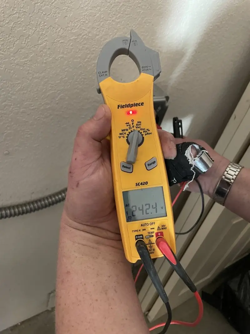 Voltage testing with clamp meter during Recessed Lighting Installation in Columbia City